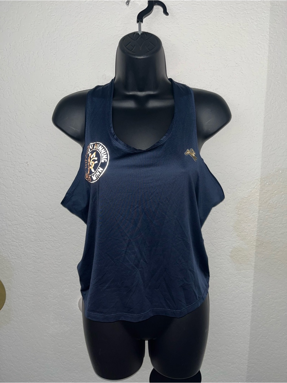 Tracksmith navy cropped tank top with logo